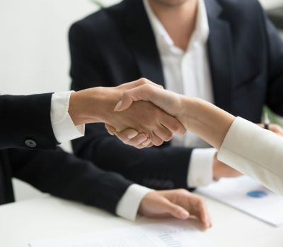 Business agreement handshake.